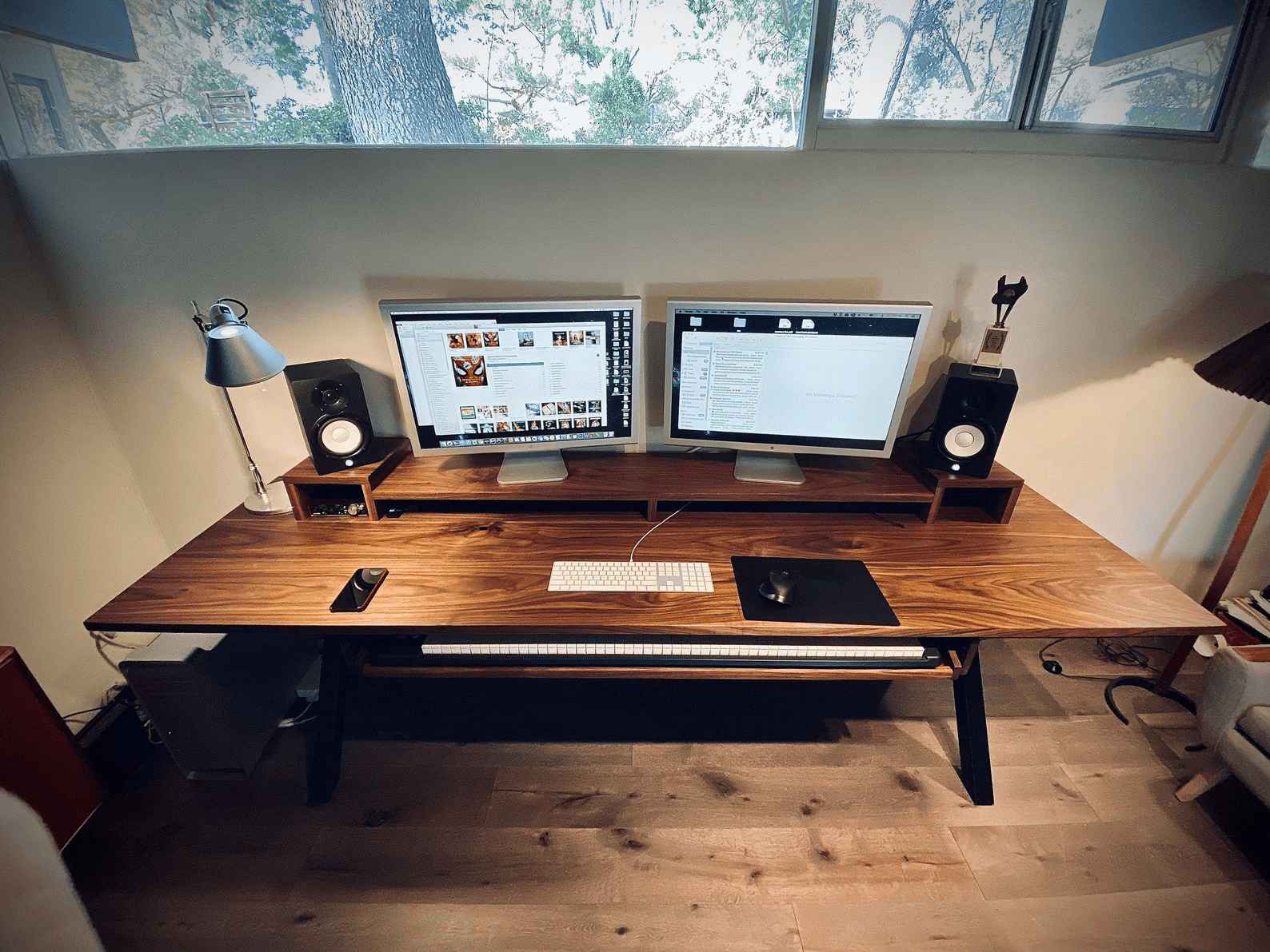 Cozy home studio with wooden desk and guitar