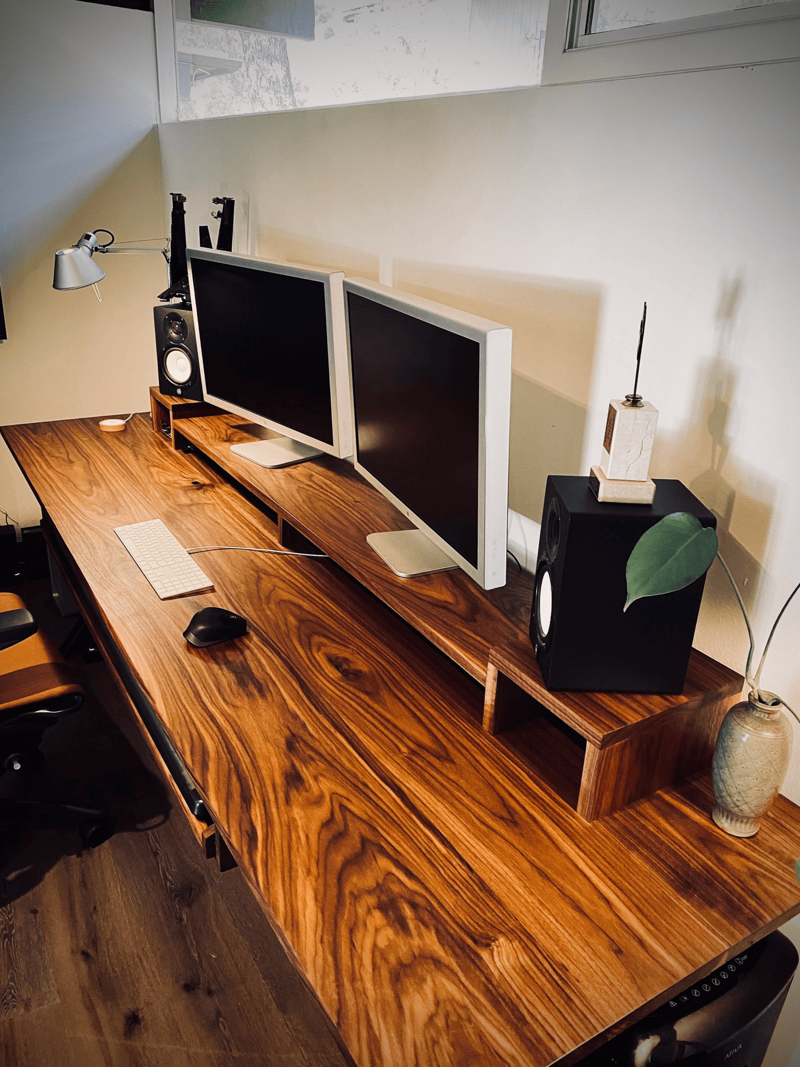 Wooden desk with dual monitors and beautiful grain